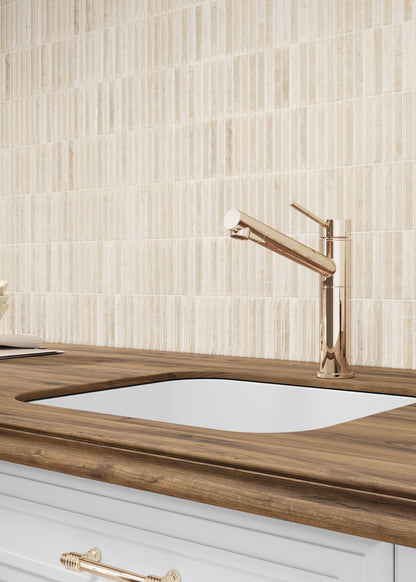 Kitchen sink with wooden countertop and tiled wall