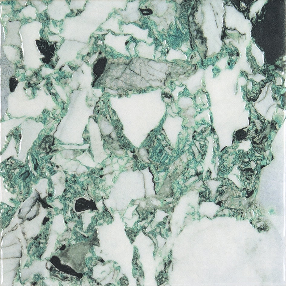 Close-up of a green and white marble effect porcelain tile.