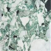 Close-up of a green and white marble effect porcelain tile.