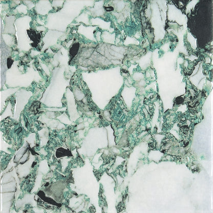 Close-up of a green and white marble effect porcelain tile.
