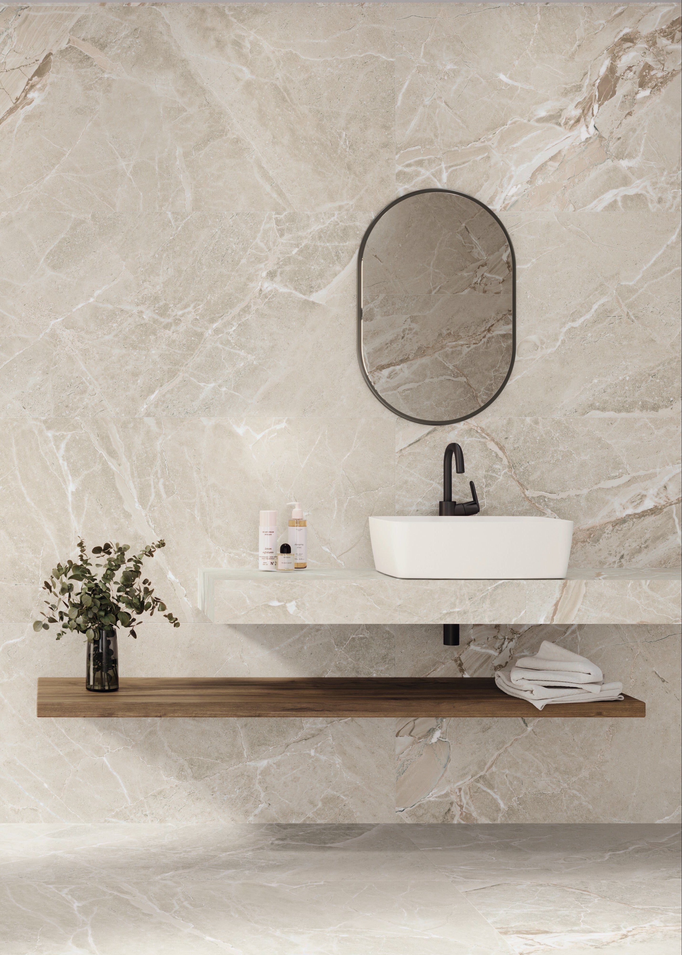 Modern bathroom with marble walls, a shower, sink, and decorative elements.