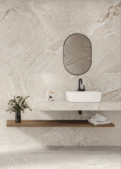 Modern bathroom with marble walls, a shower, sink, and decorative elements.